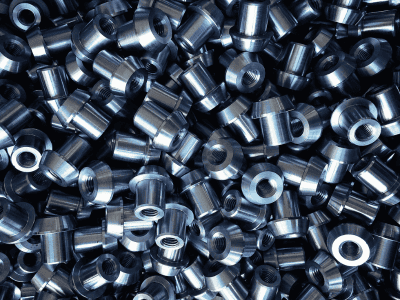 A pile of shiny metal cylindrical parts.