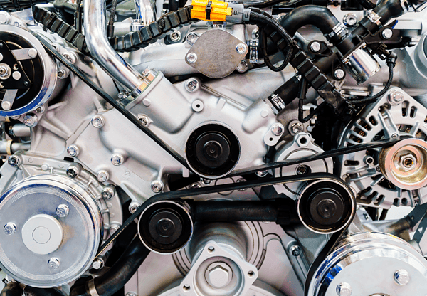 Close-up of a mechanical gearbox with detailed internal gears and components visible.