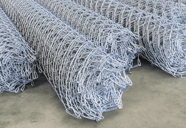 Rolls of chain-link fencing.