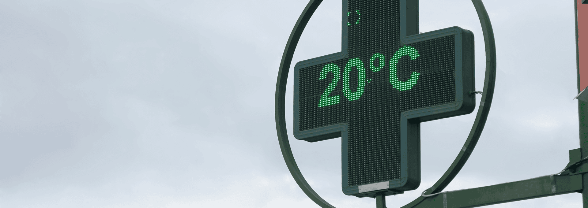 A green LED cross sign displays a temperature of 20°C, impacted by the hot rolled steel bar supporting it.