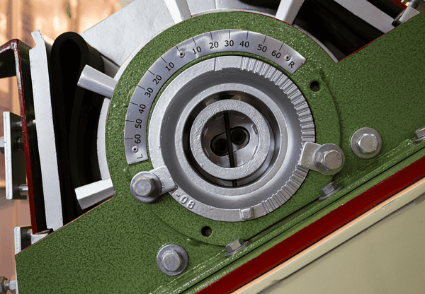 Close-up of a mechanical dial with measurement markings.