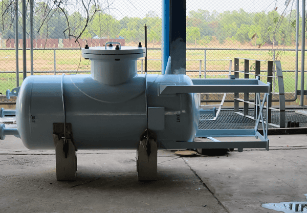 Large cylindrical industrial tank in an outdoor facility.