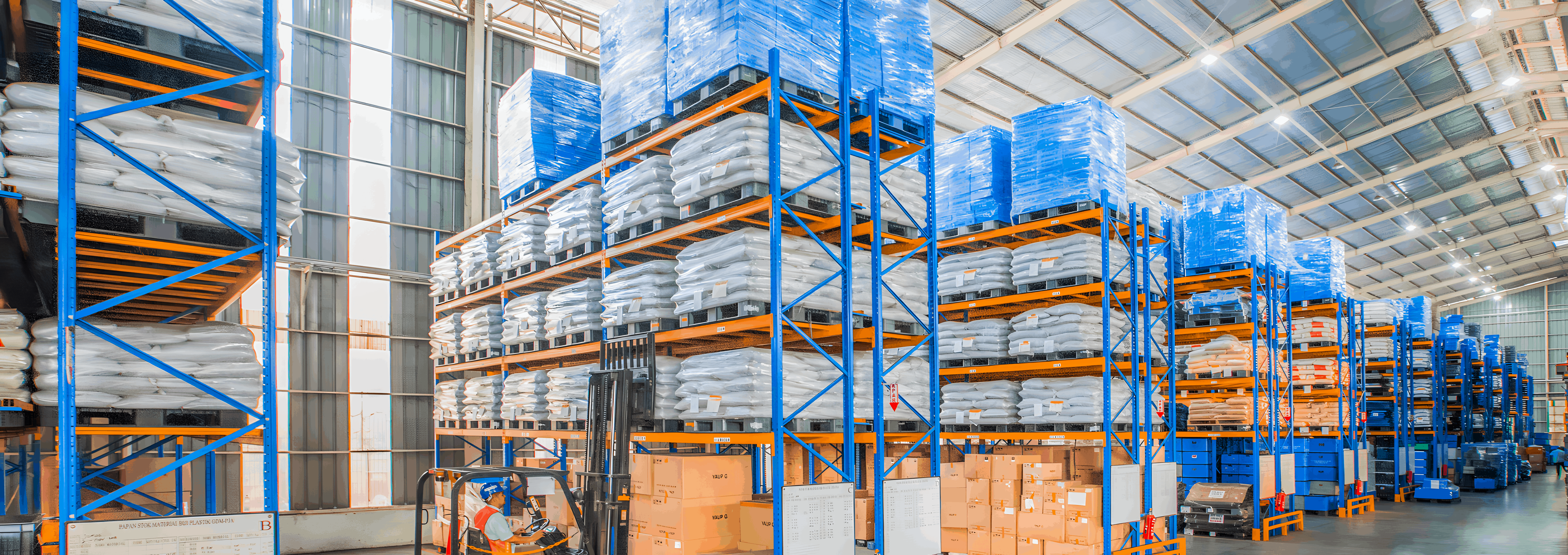 Warehouse storage with racks of tool steel bars.