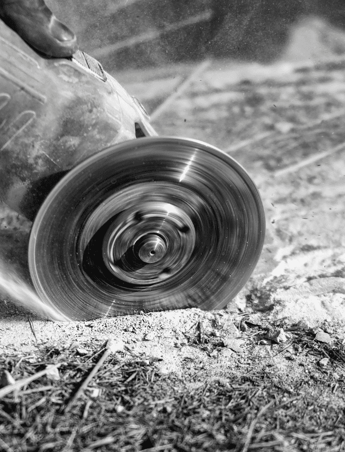 Close-up of a circular saw blade cutting through material.