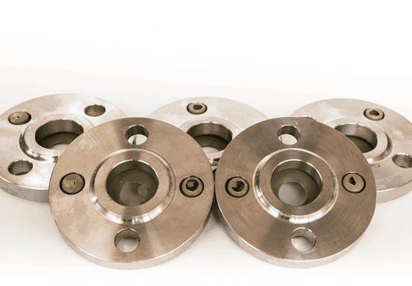 Close-up of multiple metal flanges arranged together.