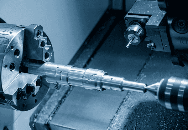 Metalworking lathe machine in action, machining a metal rod.