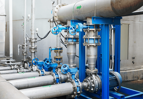 Industrial pipes and valves in a facility, constructed with X52 steel.