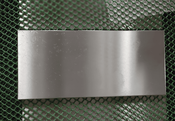 Steel sheet labeled Cr12MoV, known for its high wear resistance and toughness.