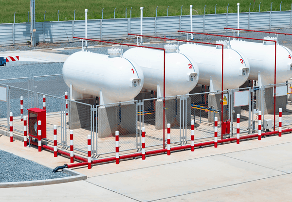 Storage tanks supported by X60 steel structures.