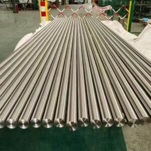 Precision-machined 4140 Steel bars neatly arranged in a production facility, ready for industrial use.