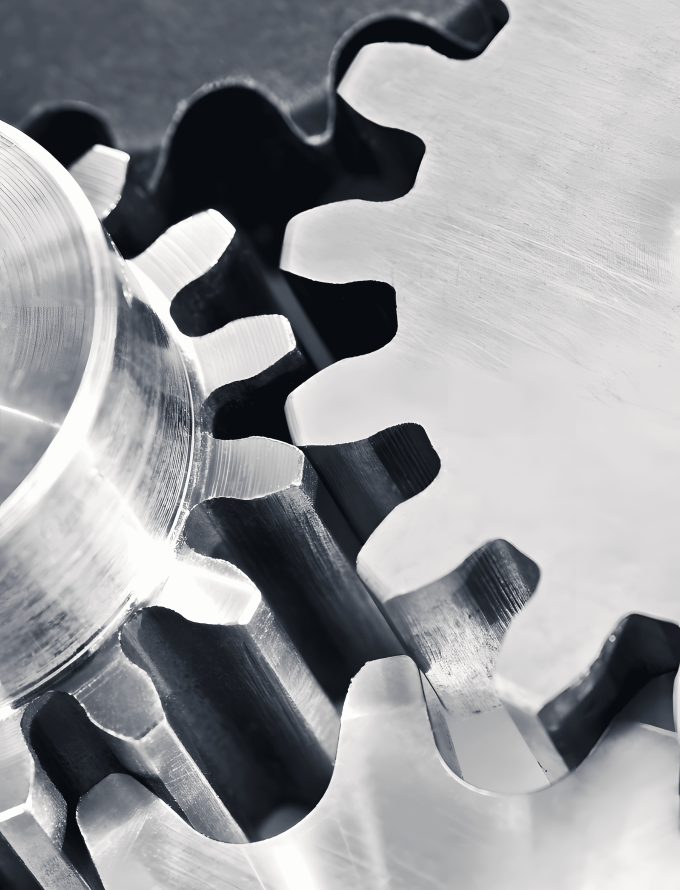 Close-up of interlocking stainless steel gears, showcasing the precision and strength of stainless steel bars used in manufacturing.