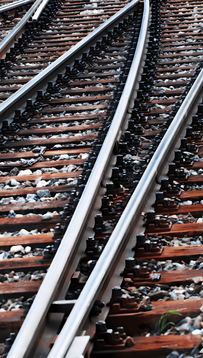 Steel railway tracks and switches, demonstrating the durability and strength required for rail tracks and railway car bodies.