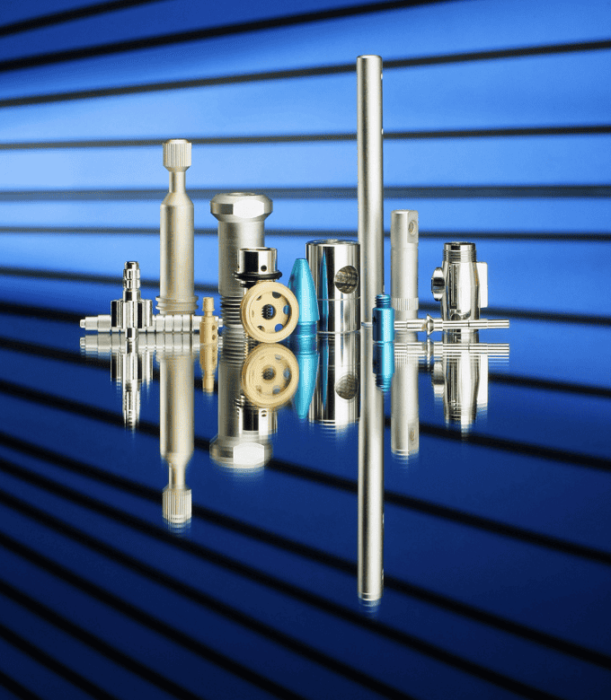 Various metal components and tools displayed on a reflective surface with a blue striped background.