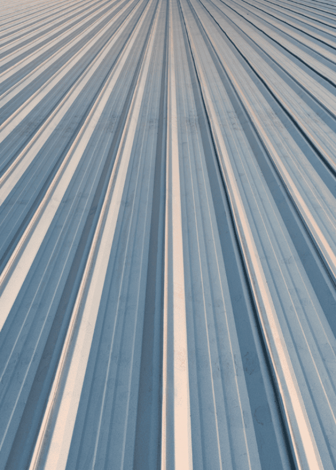 Close-up view of a corrugated metal surface with parallel ridges.