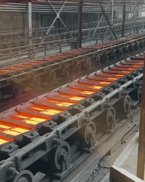 glowing hot steel slabs on a conveyor