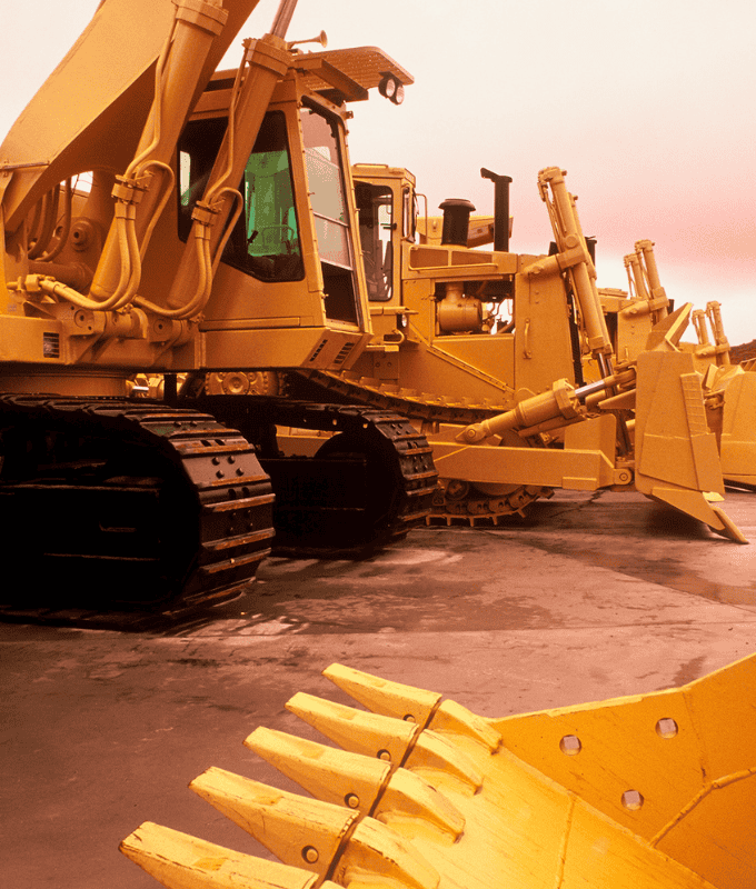 Image of yellow heavy machinery equipment, highlighting its robust components made from high-strength steel bars, emphasizing durability and efficiency in construction work.