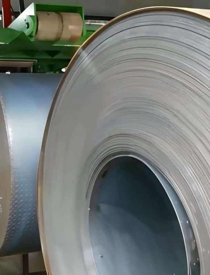 Hot rolled steel coils placed next to the rolling machine