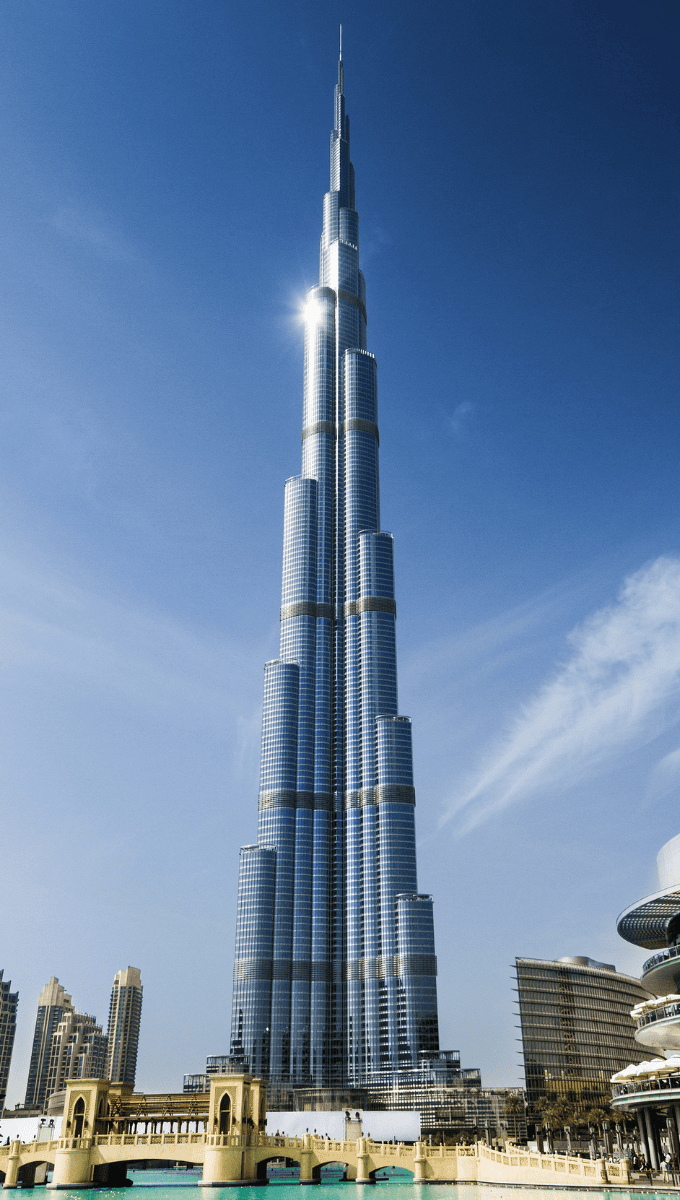 View of the Burj Khalifa skyscraper against a clear blue sky.