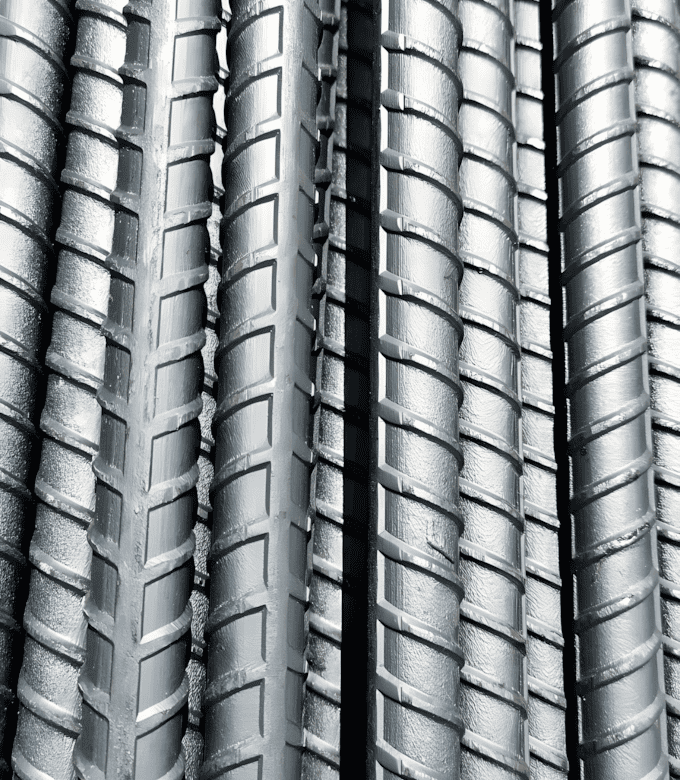 A stack of ribbed steel bars arranged vertically.