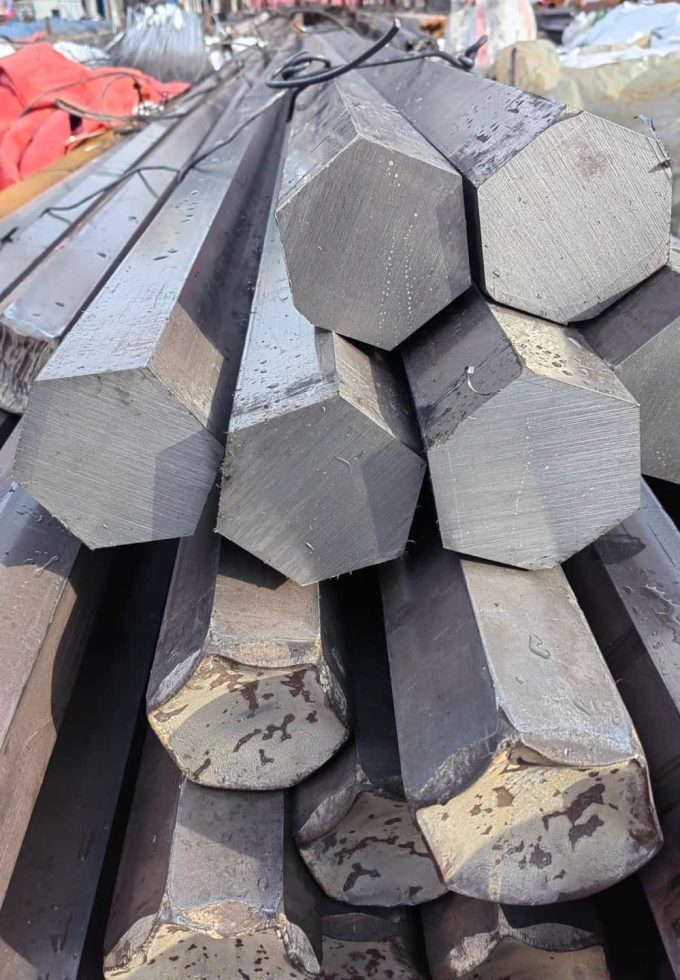 Close-up of hexagonal plain carbon steel bars.