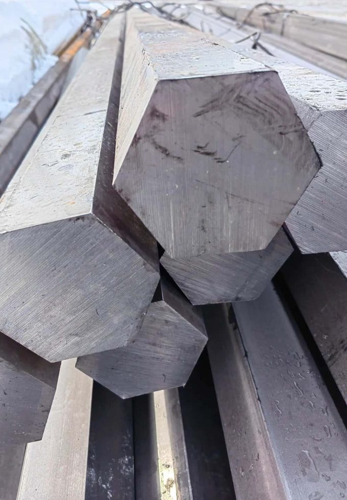 Detailed view of polished plain carbon steel bars.