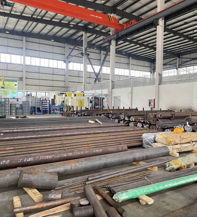 Ultra high strength steel bars stored in an industrial facility, showcasing their robustness and versatility for construction use.